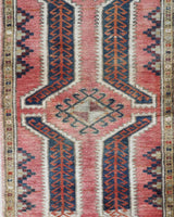 Vintage Turkish mini rug in room decor setting, old rug, antique rug, pastel colors, faded colors, Turkish rug, vintage rug, soft rug, Portland, Oregon, rug store, rug shop, local shop,  bright colors, bold colors