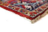 Antique Persian area rug in a living room setting, pile rug, vintage rug, portland, rug shop, bright colors, wild shaman, soft rug, bold color, Portland, Oregon, rug store, rug shop, local shop, antique rug, Persian rug, handmade rug, wool rug, distressed rug