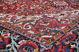 Antique Persian area rug in a living room setting, pile rug, vintage rug, portland, rug shop, bright colors, wild shaman, soft rug, bold color, Portland, Oregon, rug store, rug shop, local shop, antique rug, Persian rug, handmade rug, wool rug, distressed rug