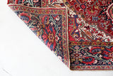 Antique Persian area rug in a living room setting, pile rug, vintage rug, portland, rug shop, bright colors, wild shaman, soft rug, bold color, Portland, Oregon, rug store, rug shop, local shop, antique rug, Persian rug, handmade rug, wool rug, distressed rug