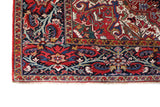Antique Persian area rug in a living room setting, pile rug, vintage rug, portland, rug shop, bright colors, wild shaman, soft rug, bold color, Portland, Oregon, rug store, rug shop, local shop, antique rug, Persian rug, handmade rug, wool rug, distressed rug