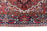 Antique Persian area rug in a living room setting, pile rug, vintage rug, portland, rug shop, bright colors, wild shaman, soft rug, bold color, Portland, Oregon, rug store, rug shop, local shop, antique rug, Persian rug, handmade rug, wool rug, distressed rug