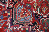 Antique Persian area rug in a living room setting, pile rug, vintage rug, portland, rug shop, bright colors, wild shaman, soft rug, bold color, Portland, Oregon, rug store, rug shop, local shop, antique rug, Persian rug, handmade rug, wool rug, distressed rug