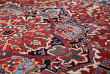 Antique Persian area rug in a living room setting, pile rug, vintage rug, portland, rug shop, bright colors, wild shaman, soft rug, bold color, Portland, Oregon, rug store, rug shop, local shop, antique rug, Persian rug, handmade rug, wool rug, distressed rug