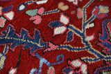 Antique Persian area rug in a living room setting, pile rug, vintage rug, portland, rug shop, bright colors, wild shaman, soft rug, bold color, Portland, Oregon, rug store, rug shop, local shop, antique rug, Persian rug, handmade rug, wool rug, distressed rug