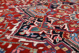 Antique Persian area rug in a living room setting, pile rug, vintage rug, portland, rug shop, bright colors, wild shaman, soft rug, bold color, Portland, Oregon, rug store, rug shop, local shop, antique rug, Persian rug, handmade rug, wool rug, distressed rug