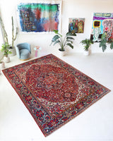 Antique Persian area rug in a living room setting, pile rug, vintage rug, portland, rug shop, bright colors, wild shaman, soft rug, bold color, Portland, Oregon, rug store, rug shop, local shop, antique rug, Persian rug, handmade rug, wool rug, distressed rug