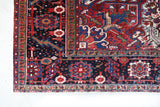 Antique Persian area rug in a living room setting, pile rug, vintage rug, portland, rug shop, bright colors, wild shaman, soft rug, bold color, Portland, Oregon, rug store, rug shop, local shop, antique rug, Persian rug, handmade rug, wool rug, distressed rug