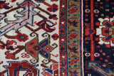 Antique Persian area rug in a living room setting, pile rug, vintage rug, portland, rug shop, bright colors, wild shaman, soft rug, bold color, Portland, Oregon, rug store, rug shop, local shop, antique rug, Persian rug, handmade rug, wool rug, distressed rug