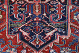Antique Persian area rug in a living room setting, pile rug, vintage rug, portland, rug shop, bright colors, wild shaman, soft rug, bold color, Portland, Oregon, rug store, rug shop, local shop, antique rug, Persian rug, handmade rug, wool rug, distressed rug