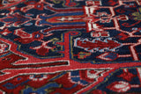 Antique Persian area rug in a living room setting, pile rug, vintage rug, portland, rug shop, bright colors, wild shaman, soft rug, bold color, Portland, Oregon, rug store, rug shop, local shop, antique rug, Persian rug, handmade rug, wool rug, distressed rug