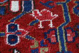 Antique Persian area rug in a living room setting, pile rug, vintage rug, portland, rug shop, bright colors, wild shaman, soft rug, bold color, Portland, Oregon, rug store, rug shop, local shop, antique rug, Persian rug, handmade rug, wool rug, distressed rug