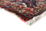 Antique Persian area rug in a living room setting, pile rug, vintage rug, portland, rug shop, bright colors, wild shaman, soft rug, bold color, Portland, Oregon, rug store, rug shop, local shop, antique rug, Persian rug, handmade rug, wool rug, distressed rug