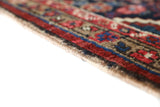 Antique Persian area rug in a living room setting, pile rug, vintage rug, portland, rug shop, bright colors, wild shaman, soft rug, bold color, Portland, Oregon, rug store, rug shop, local shop, antique rug, Persian rug, handmade rug, wool rug, distressed rug