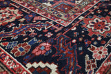 Antique Persian area rug in a living room setting, pile rug, vintage rug, portland, rug shop, bright colors, wild shaman, soft rug, bold color, Portland, Oregon, rug store, rug shop, local shop, antique rug, Persian rug, handmade rug, wool rug, distressed rug