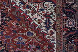 Antique Persian area rug in a living room setting, pile rug, vintage rug, portland, rug shop, bright colors, wild shaman, soft rug, bold color, Portland, Oregon, rug store, rug shop, local shop, antique rug, Persian rug, handmade rug, wool rug, distressed rug