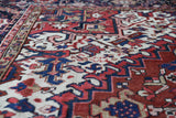 Antique Persian area rug in a living room setting, pile rug, vintage rug, portland, rug shop, bright colors, wild shaman, soft rug, bold color, Portland, Oregon, rug store, rug shop, local shop, antique rug, Persian rug, handmade rug, wool rug, distressed rug