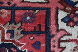 Antique Persian area rug in a living room setting, pile rug, vintage rug, portland, rug shop, bright colors, wild shaman, soft rug, bold color, Portland, Oregon, rug store, rug shop, local shop, antique rug, Persian rug, handmade rug, wool rug, distressed rug