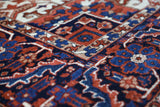 Antique Persian area rug in a living room setting, pile rug, vintage rug, portland, rug shop, bright colors, wild shaman, soft rug, bold color, Portland, Oregon, rug store, rug shop, local shop, antique rug, Persian rug, handmade rug, wool rug, distressed rug