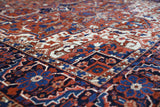 Antique Persian area rug in a living room setting, pile rug, vintage rug, portland, rug shop, bright colors, wild shaman, soft rug, bold color, Portland, Oregon, rug store, rug shop, local shop, antique rug, Persian rug, handmade rug, wool rug, distressed rug