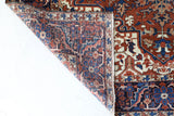 Antique Persian area rug in a living room setting, pile rug, vintage rug, portland, rug shop, bright colors, wild shaman, soft rug, bold color, Portland, Oregon, rug store, rug shop, local shop, antique rug, Persian rug, handmade rug, wool rug, distressed rug