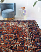 Antique Persian area rug in a living room setting, pile rug, vintage rug, portland, rug shop, bright colors, wild shaman, soft rug, bold color, Portland, Oregon, rug store, rug shop, local shop, antique rug, Persian rug, handmade rug, wool rug, distressed rug