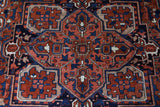 Antique Persian area rug in a living room setting, pile rug, vintage rug, portland, rug shop, bright colors, wild shaman, soft rug, bold color, Portland, Oregon, rug store, rug shop, local shop, antique rug, Persian rug, handmade rug, wool rug, distressed rug
