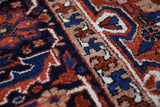 Antique Persian area rug in a living room setting, pile rug, vintage rug, portland, rug shop, bright colors, wild shaman, soft rug, bold color, Portland, Oregon, rug store, rug shop, local shop, antique rug, Persian rug, handmade rug, wool rug, distressed rug
