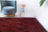 Antique Turkmen rug in a living room setting, pile rug, Turkish rug, vintage rug, portland, rug shop, bright colors, wild shaman, soft rug, bold color, Portland, Oregon, rug store, rug shop, local shop, antique rug