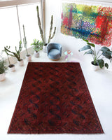 Antique Turkmen rug in a living room setting, pile rug, Turkish rug, vintage rug, portland, rug shop, bright colors, wild shaman, soft rug, bold color, Portland, Oregon, rug store, rug shop, local shop, antique rug