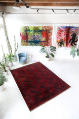 Antique Turkmen rug in a living room setting, pile rug, Turkish rug, vintage rug, portland, rug shop, bright colors, wild shaman, soft rug, bold color, Portland, Oregon, rug store, rug shop, local shop, antique rug