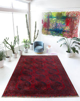 Antique Turkmen rug in a living room setting, pile rug, Turkish rug, vintage rug, portland, rug shop, bright colors, wild shaman, soft rug, bold color, Portland, Oregon, rug store, rug shop, local shop, antique rug