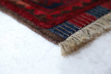 Antique Turkmen rug in a living room setting, pile rug, Turkish rug, vintage rug, portland, rug shop, bright colors, wild shaman, soft rug, bold color, Portland, Oregon, rug store, rug shop, local shop, antique rug