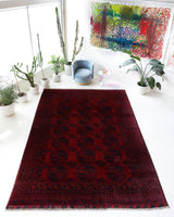 Antique Turkmen rug in a living room setting, pile rug, Turkish rug, vintage rug, portland, rug shop, bright colors, wild shaman, soft rug, bold color, Portland, Oregon, rug store, rug shop, local shop, antique rug