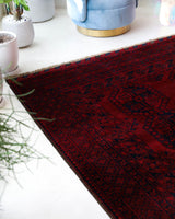 Antique Turkmen rug in a living room setting, pile rug, Turkish rug, vintage rug, portland, rug shop, bright colors, wild shaman, soft rug, bold color, Portland, Oregon, rug store, rug shop, local shop, antique rug