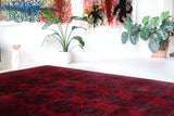 Antique Turkmen rug in a living room setting, pile rug, Turkish rug, vintage rug, portland, rug shop, bright colors, wild shaman, soft rug, bold color, Portland, Oregon, rug store, rug shop, local shop, antique rug
