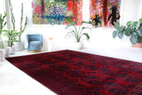 Antique Turkmen rug in a living room setting, pile rug, Turkish rug, vintage rug, portland, rug shop, bright colors, wild shaman, soft rug, bold color, Portland, Oregon, rug store, rug shop, local shop, antique rug