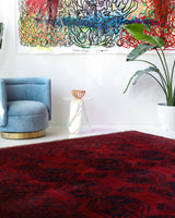 Antique Turkmen rug in a living room setting, pile rug, Turkish rug, vintage rug, portland, rug shop, bright colors, wild shaman, soft rug, bold color, Portland, Oregon, rug store, rug shop, local shop, antique rug