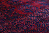 Antique Turkmen rug in a living room setting, pile rug, Turkish rug, vintage rug, portland, rug shop, bright colors, wild shaman, soft rug, bold color, Portland, Oregon, rug store, rug shop, local shop, antique rug