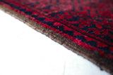 Antique Turkmen rug in a living room setting, pile rug, Turkish rug, vintage rug, portland, rug shop, bright colors, wild shaman, soft rug, bold color, Portland, Oregon, rug store, rug shop, local shop, antique rug