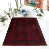 Antique Turkmen rug in a living room setting, pile rug, Turkish rug, vintage rug, portland, rug shop, bright colors, wild shaman, soft rug, bold color, Portland, Oregon, rug store, rug shop, local shop, antique rug