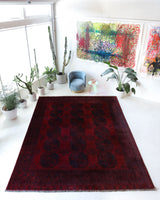 Antique Turkmen rug in a living room setting, pile rug, Turkish rug, vintage rug, portland, rug shop, bright colors, wild shaman, soft rug, bold color, Portland, Oregon, rug store, rug shop, local shop, antique rug