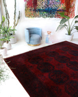 Antique Turkmen rug in a living room setting, pile rug, Turkish rug, vintage rug, portland, rug shop, bright colors, wild shaman, soft rug, bold color, Portland, Oregon, rug store, rug shop, local shop, antique rug