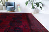 Antique Turkmen rug in a living room setting, pile rug, Turkish rug, vintage rug, portland, rug shop, bright colors, wild shaman, soft rug, bold color, Portland, Oregon, rug store, rug shop, local shop, antique rug