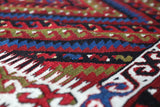 Vintage kilim rug in living room setting, bright colors, wild shaman, soft rug, bold color, Portland, Oregon, rug store, rug shop, local shop, vintage rug, modern kilim, warm colors, antique kilim rug