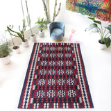 Vintage kilim rug in living room setting, bright colors, wild shaman, soft rug, bold color, Portland, Oregon, rug store, rug shop, local shop, vintage rug, modern kilim, warm colors, antique kilim rug