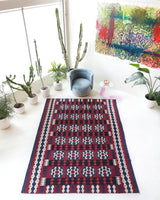 Vintage kilim rug in living room setting, bright colors, wild shaman, soft rug, bold color, Portland, Oregon, rug store, rug shop, local shop, vintage rug, modern kilim, warm colors, antique kilim rug
