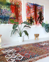 Vintage kilim rug in living room setting, old rug, antique rug, pastel colors, faded colors, Turkish rug, vintage rug, soft rug, Portland, Oregon, rug store, rug shop, local shop, earthy tones, earthy colors, warm colors