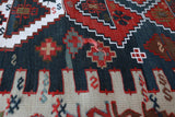 Vintage kilim rug in living room setting, old rug, antique rug, pastel colors, faded colors, Turkish rug, vintage rug, soft rug, Portland, Oregon, rug store, rug shop, local shop, earthy tones, earthy colors, warm colors