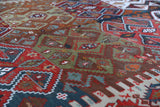 Vintage kilim rug in living room setting, old rug, antique rug, pastel colors, faded colors, Turkish rug, vintage rug, soft rug, Portland, Oregon, rug store, rug shop, local shop, earthy tones, earthy colors, warm colors